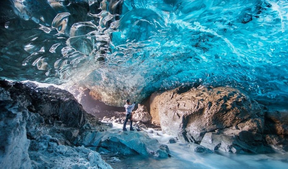The Blue Ice Caves of Iceland are natural phenomena that are formed in glaciers during winter. The blue color occurs when snow falls on the glacier, is compressed and becomes part of it. Air bubbles form and are squeezed out, which results in enlarged ice crystals that create the blue appearance.