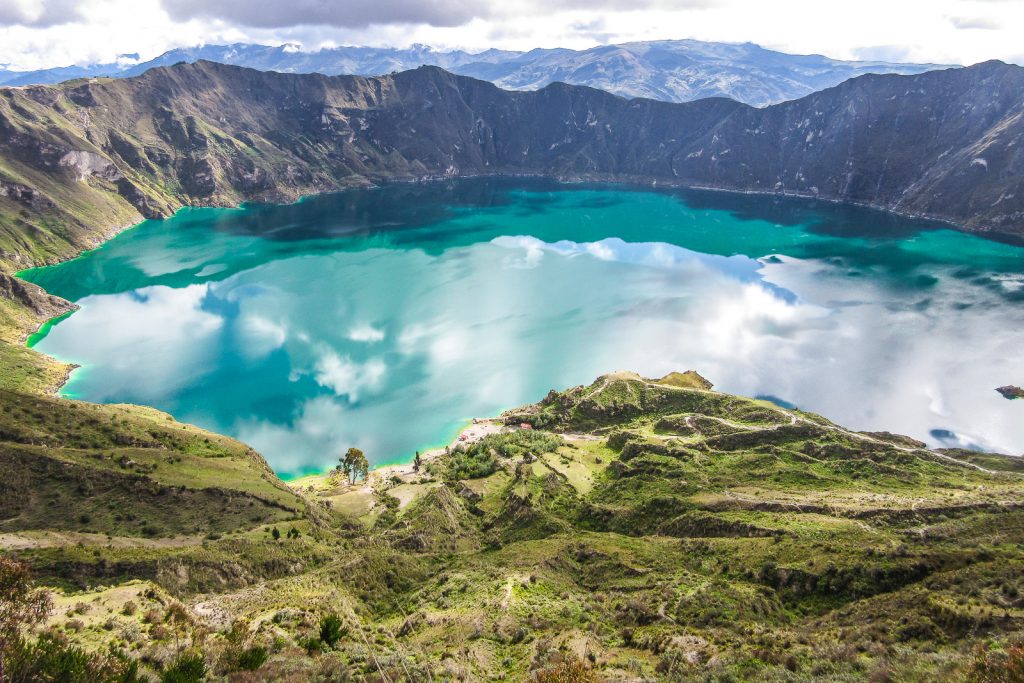 This crater lake in the Andes has water that has turned greenish because of the minerals in the water. The crater is 3 km wide and just looks amazing in between all those mountain tops.
